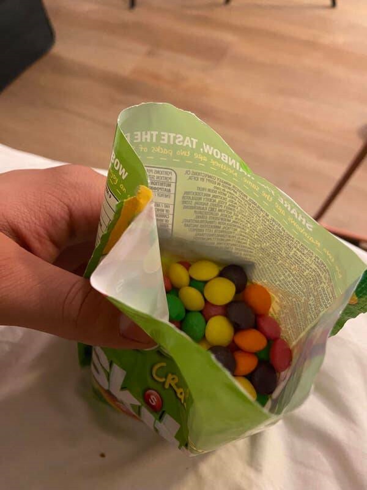 Sour Skittles in Europe don't have the iconic sour dust on them:
