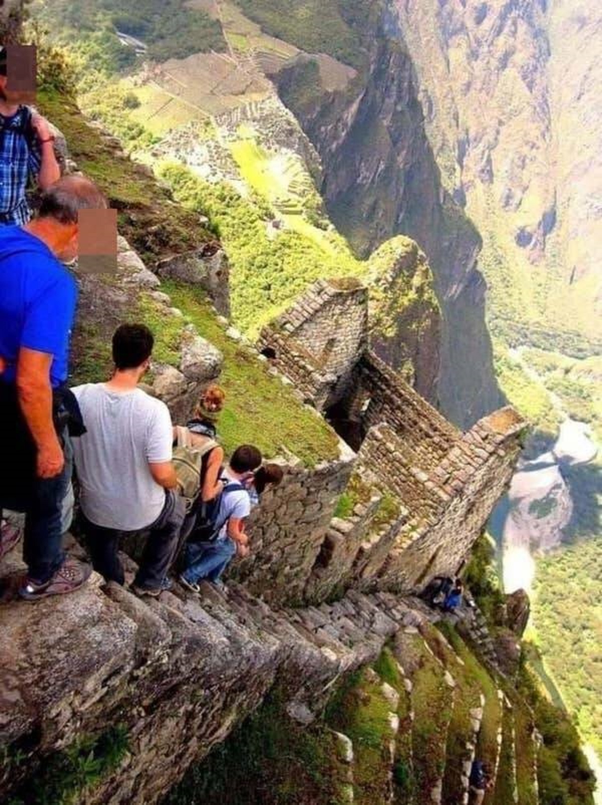 These are the "Stairs of Death," an extremely steep staircase located in Peru's Huayna Picchu: