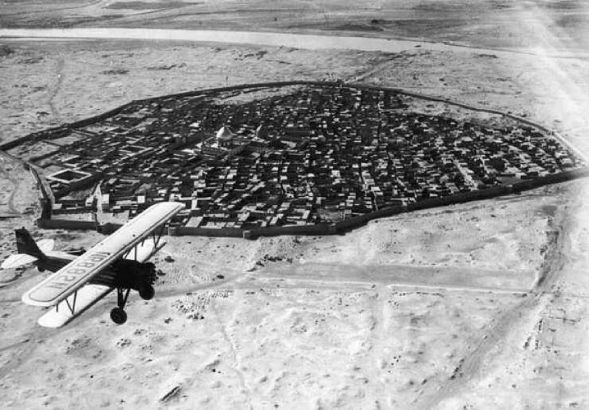 This picture, from 1930, shows a plane flying over the old city of Baghdad, Iraq: