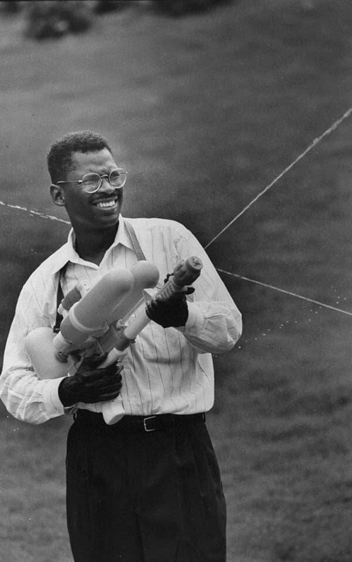 This is Lonnie Johnson, inventor of the Super Soaker, enjoying his invention: