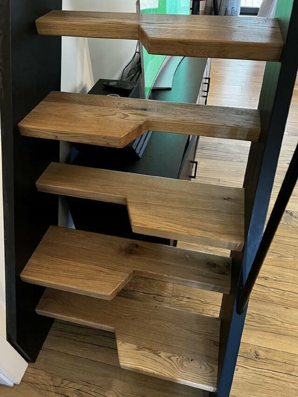 "This space saving staircase has alternating half steps"
