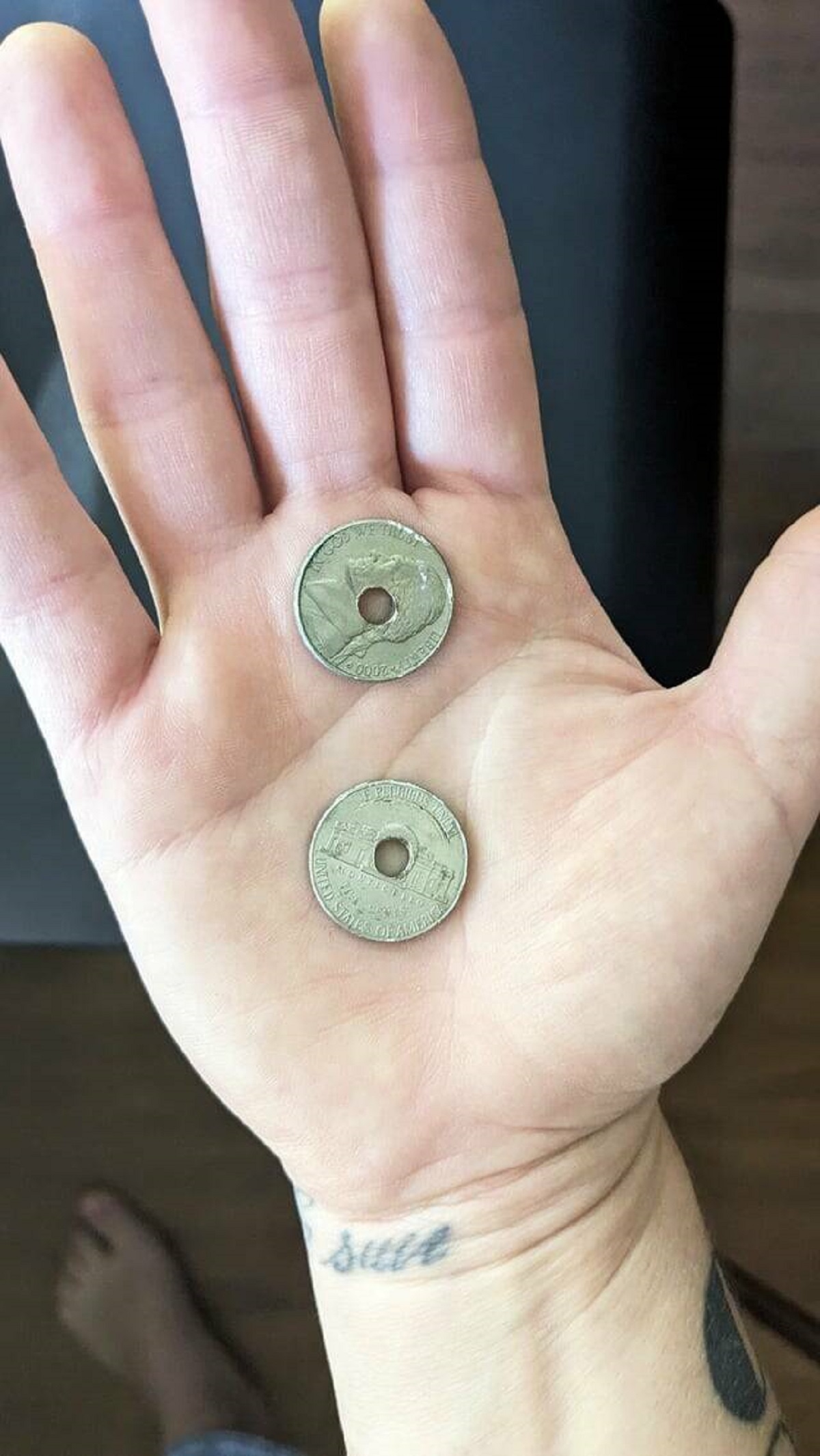 "My landlord used nickels instead of washers for my cabinet knobs"