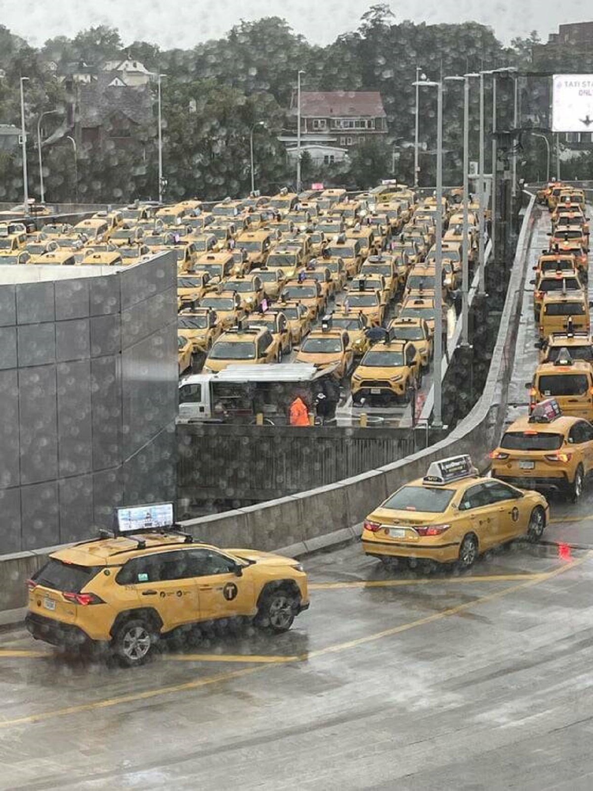 "Cabs and more cabs lining up to pick up passengers at LaGuardia"