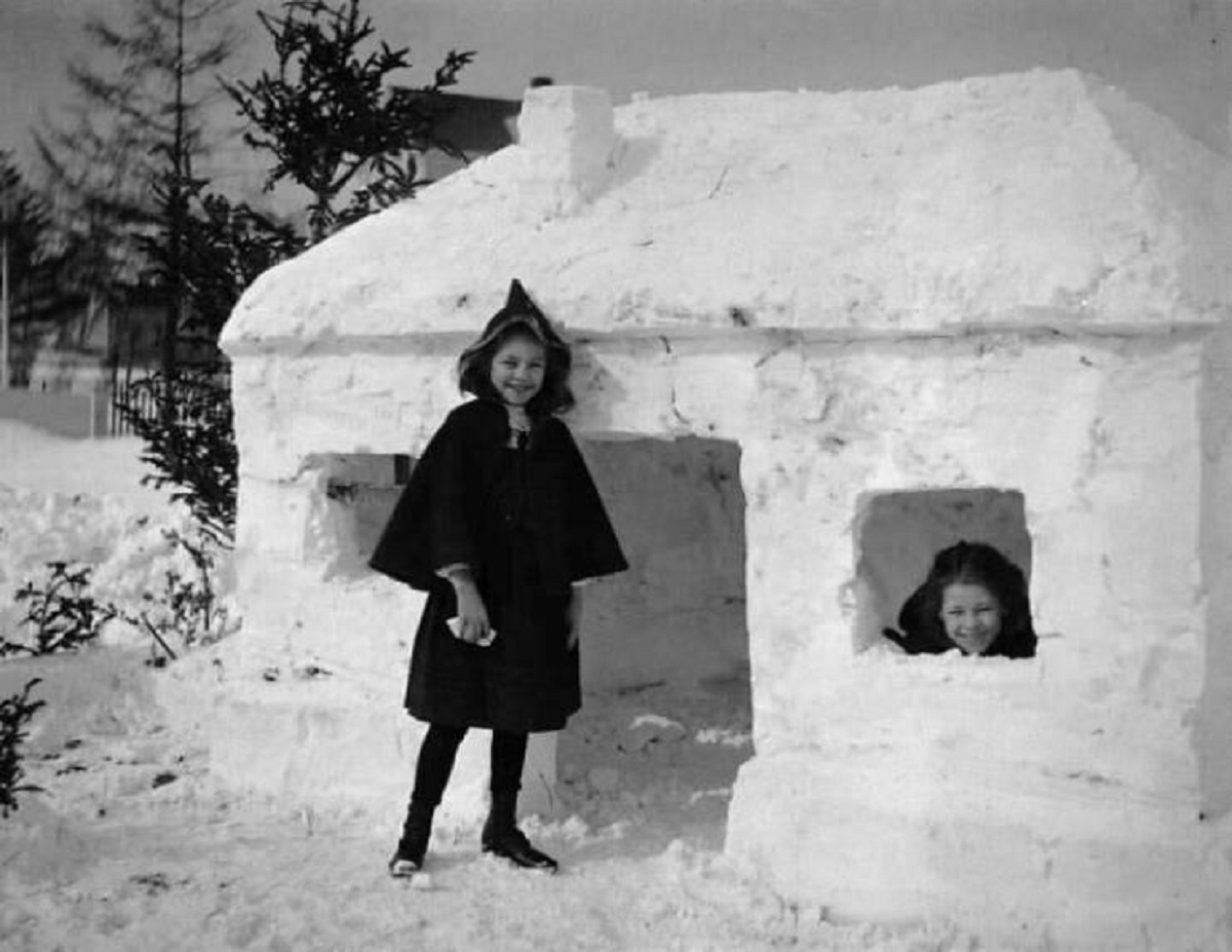 "Two Girls Pose With Their Snow Fort, 1910"