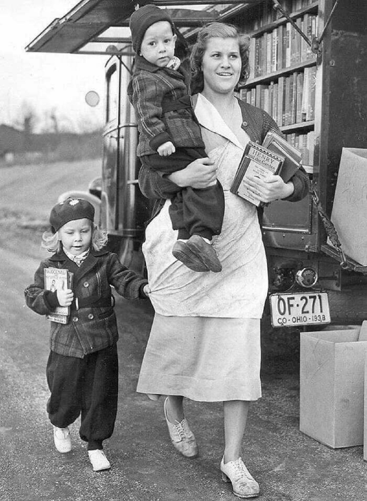 "A Happy Family Taking Home Their Book Haul From The Cincinnati Library Bookmobile In 1940"