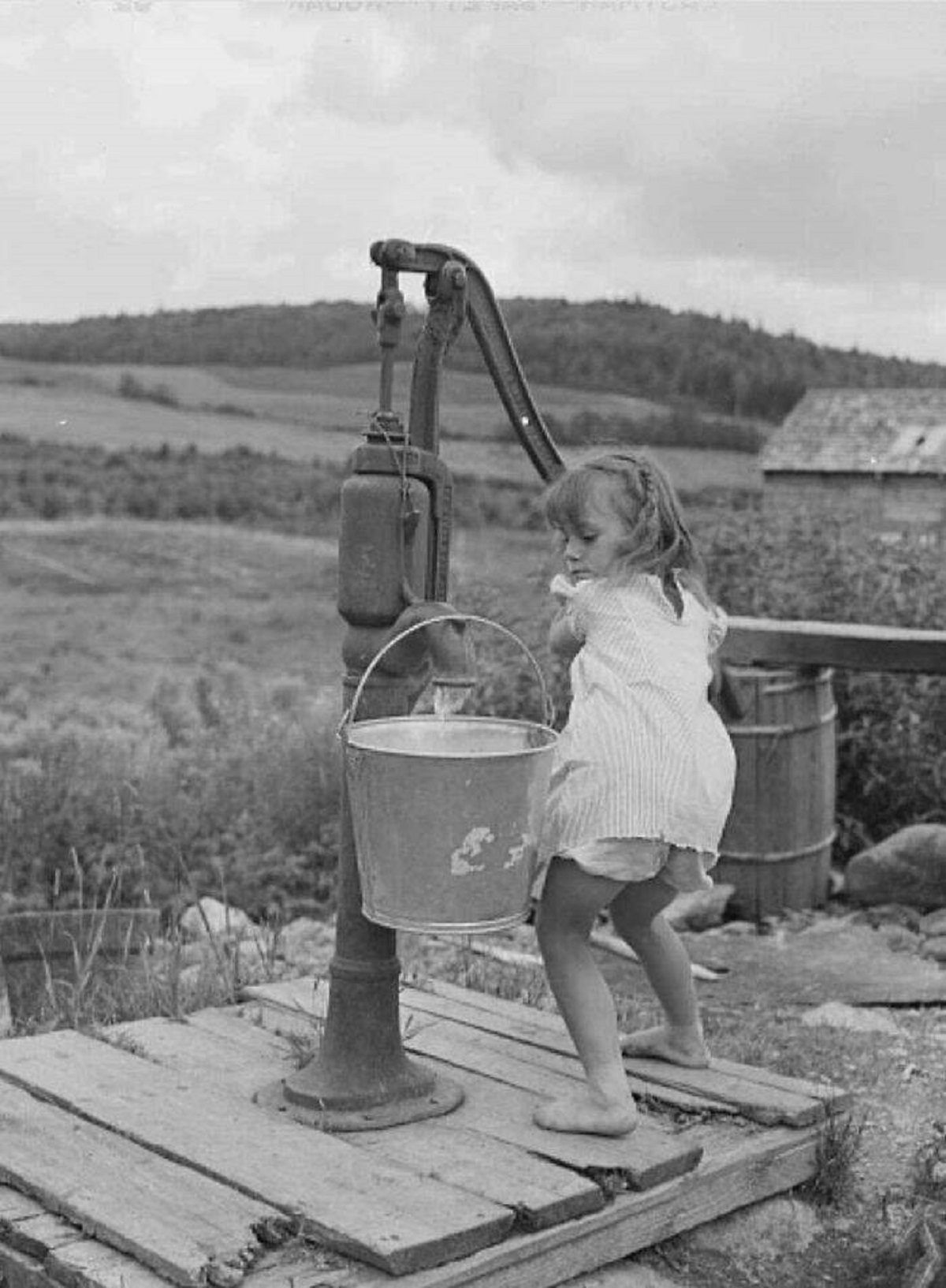 "Little Girl Getting Water At The Farm, Maine, 1942"