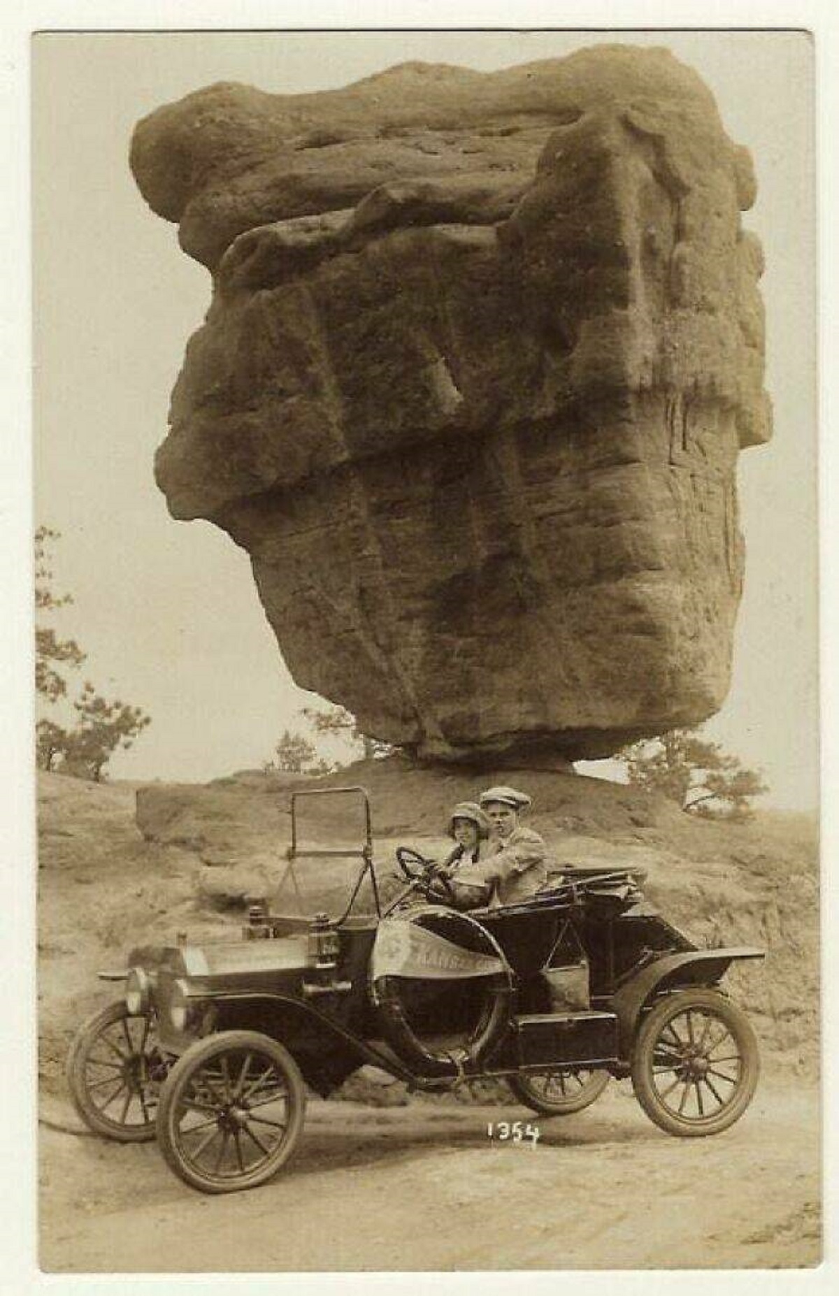 "A Couple In A Model T Ford At Balanced Rock, Colorado, 1920s."