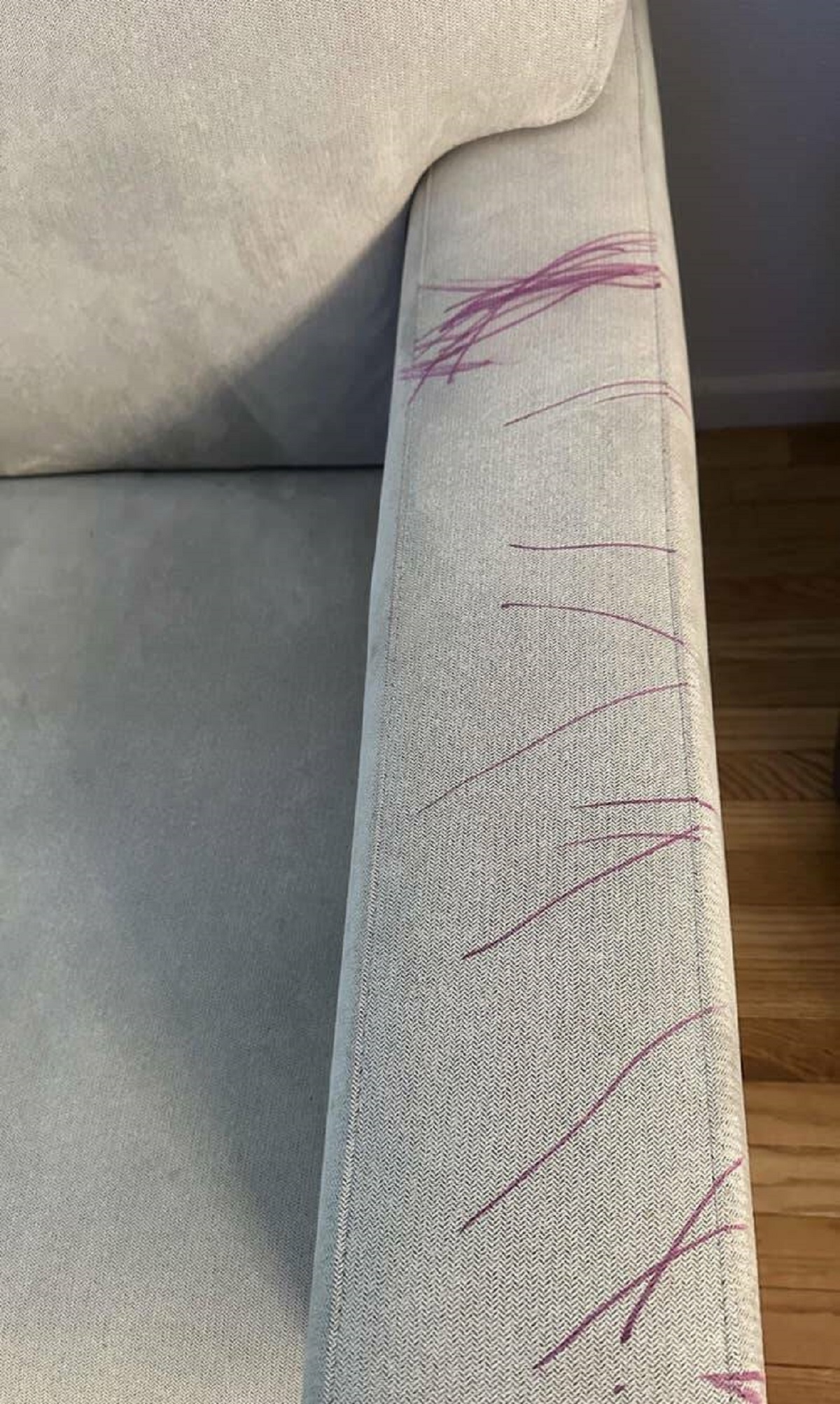 This parent's two-year-old son who found a purple permanent marker and drew a masterpiece on the new couch: