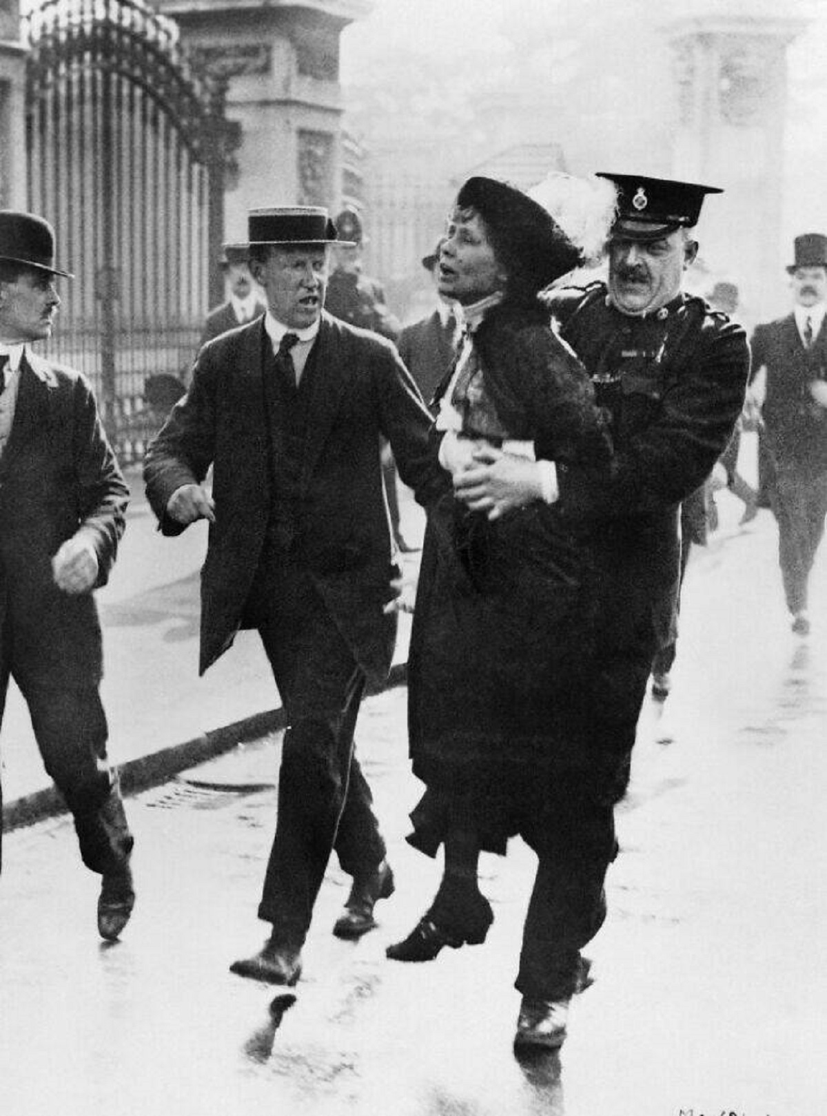 "Emmeline Pankhurst Arrested Outside Buckingham Palace, 1914"

"Suffragette leader Emmeline Pankhurst being carried away from Buckingham Palace in London, England after being arrested while trying to present a petition to King George V of the United Kingdom, 21st May 1914."