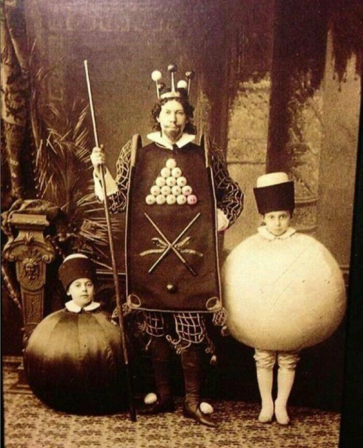 "Celebrating Halloween In 1886: A Man Adorns Himself As The Billiards King While His Two Sons Attire As The 8 Ball And Cue Ball"