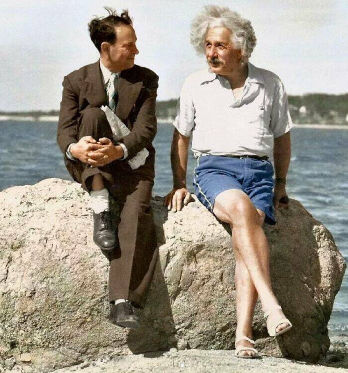 "In 1939, Albert Einstein Was Captured In A Photo At Nassau Point, New York, Sporting Sandals"

"Seated beside him was his friend and local store proprietor, David Rothman. An amusing incident preceded this snapshot, stemming from Einstein's heavily accented request for a pair of "sundahls," which Rothman misunderstood as "sundial." After some initial confusion in the store, Einstein eventually acquired the white sandals he was wearing for $1.35. He took the situation in good humor, attributing it to his "atrocious accent." Despite the mix-up, the two men maintained a strong friendship."