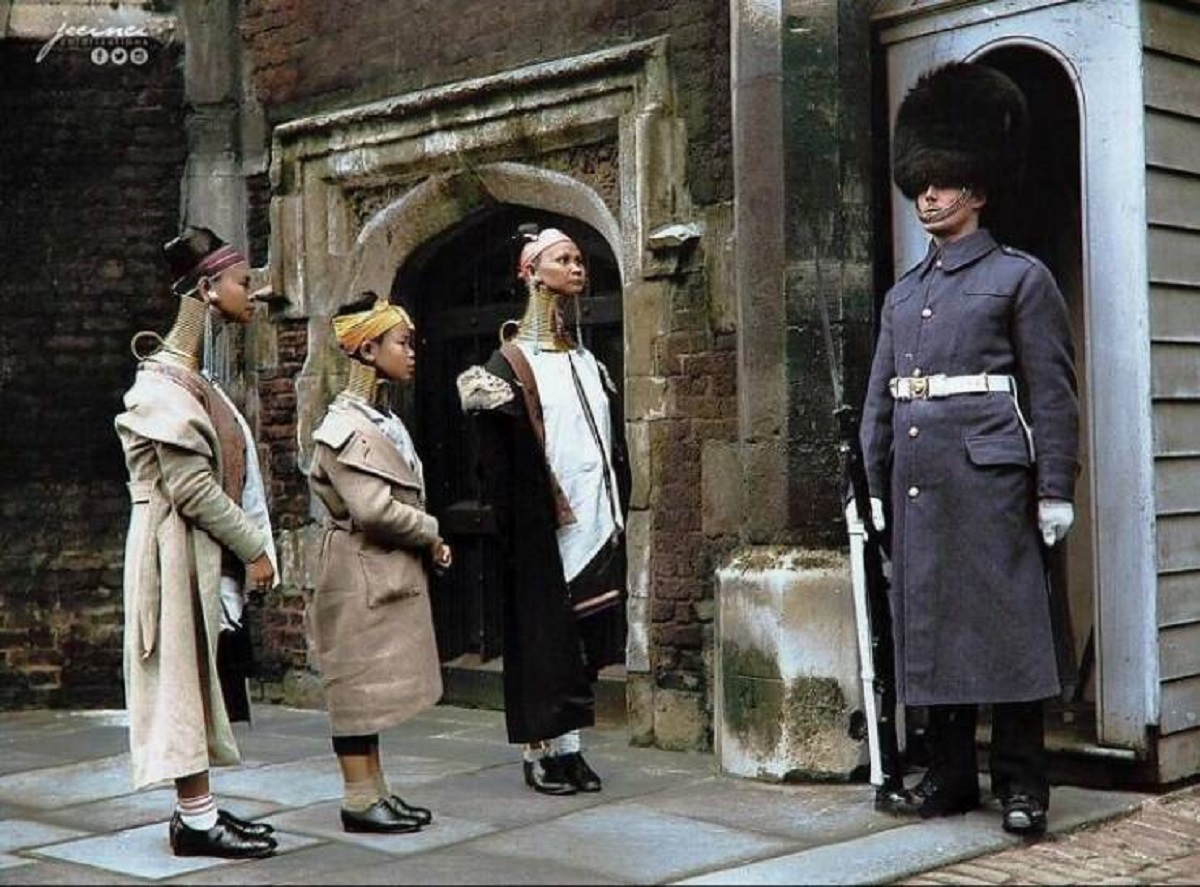 "In 1935, While Visiting London, Kayan Lahwi Women Observed A Guard Stationed At St James's Palace"

"The Kayan Lahwi, alternatively referred to as Padaung, constitute a minority ethnic community residing in Myanmar and Thailand. Their unique tradition involves elongating coils as the women mature, which results in the compression of the rib cage and the displacement of the collarbone. This practice gives the illusion of an extraordinarily elongated neck."