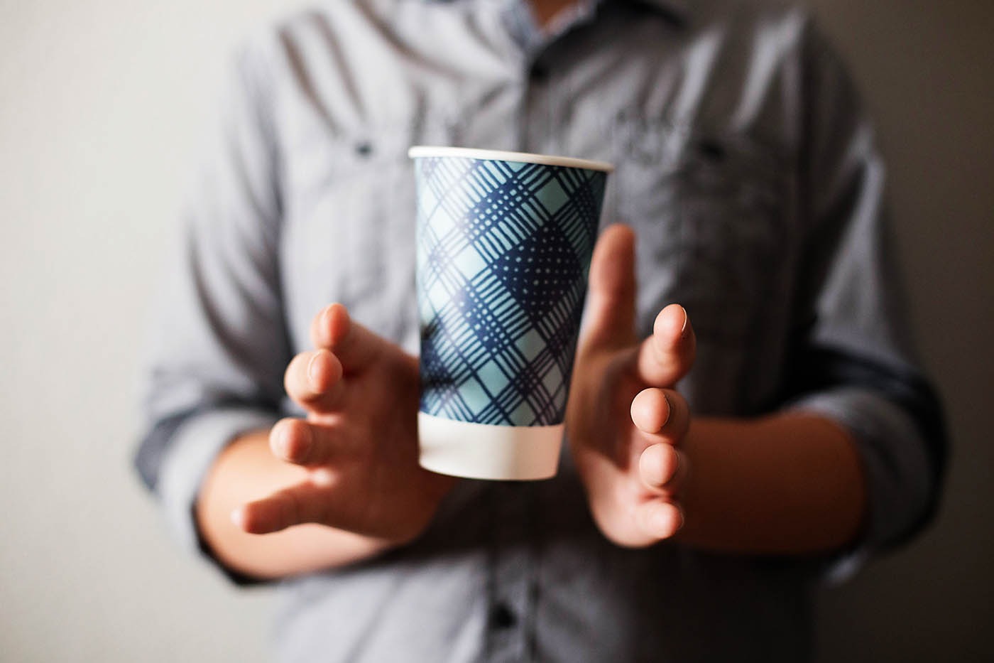 The floating cup illusion captivates observers as the magician seemingly levitates a cup between hands, implying telekinetic control. Starting conventionally, the magician gradually separates hands, revealing the apparent levitation. Although true mid-air levitation remains elusive, this trick, achieved by discreetly poking a hole in a styrofoam cup while distracting the audience, offers an impressive performance suitable for any party. Skillful execution and strategic positioning ensure the audience remains unaware of the trick's mechanics.