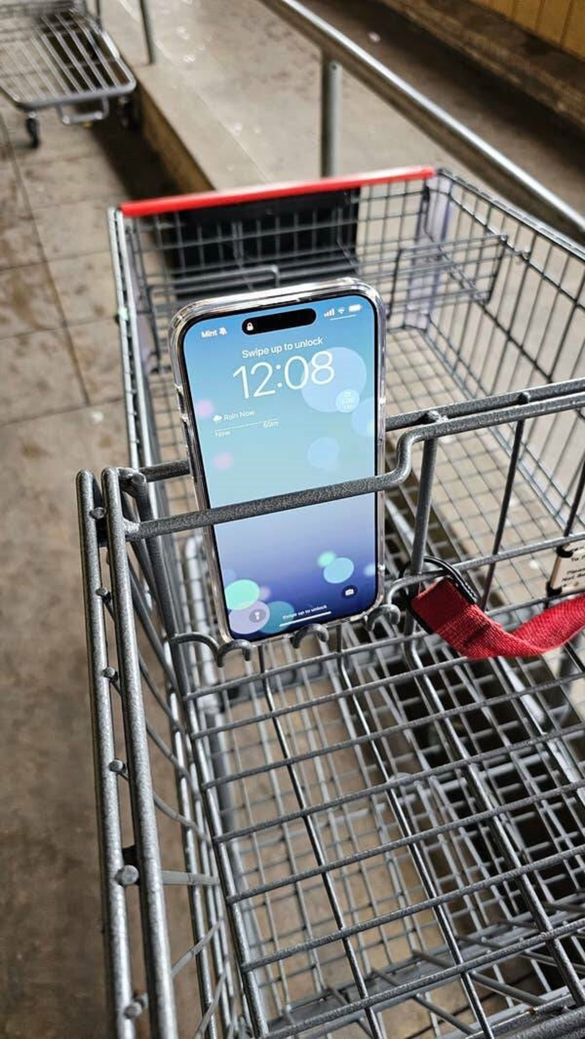 Some grocery carts have special little holders for your phone: