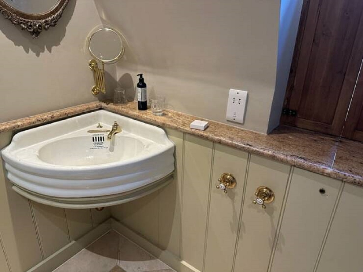 "The placement of the knobs for this hotel sink"