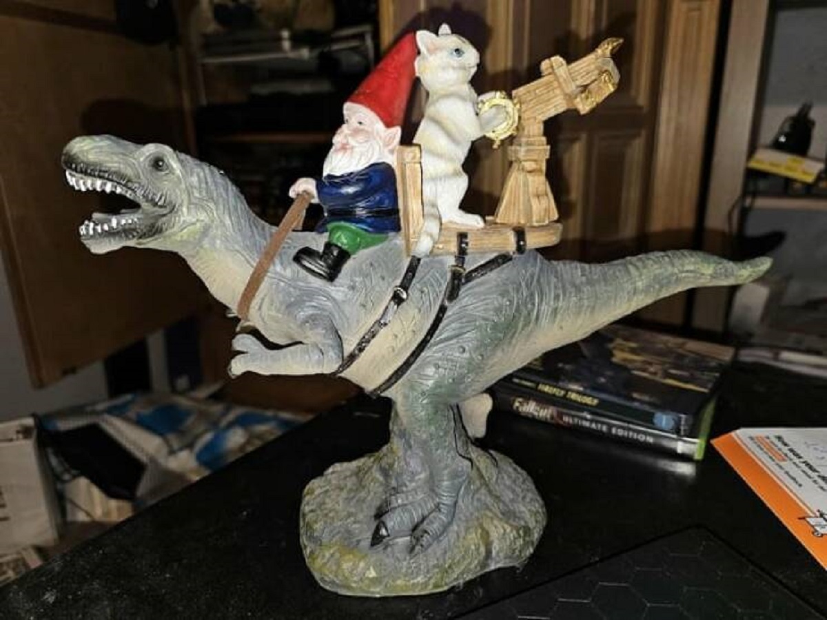 "Today at Goodwill, I found a gnome riding a T-Rex accompanied by a kitty cat gunner with a mounted crossbow"