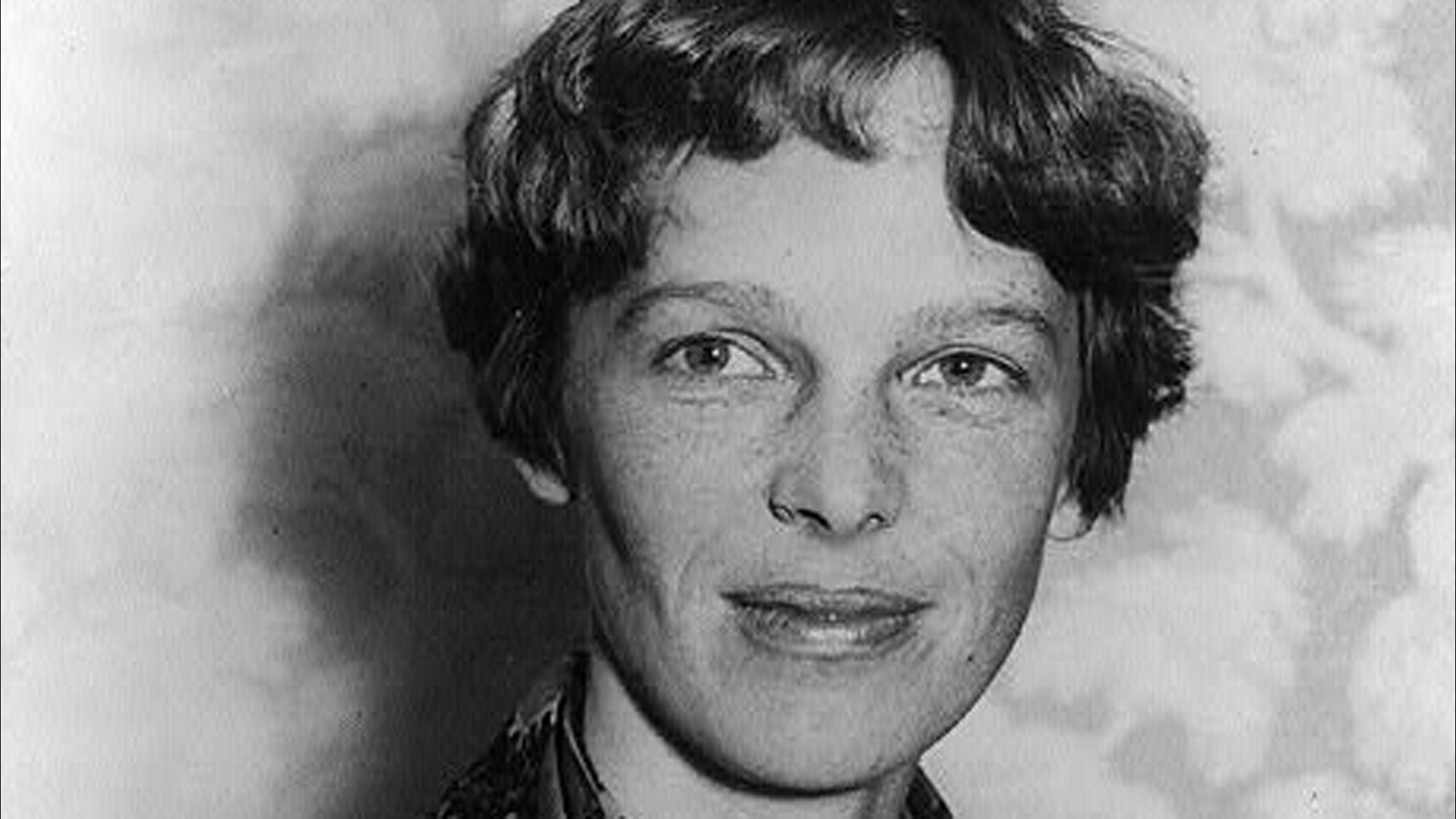 Amelia Earhart, a renowned aviator, vanished in 1937 during her global flight attempt. Contrary to popular belief, her plane landed on a Pacific island, and radio transmissions were received for days. The U.S. Navy dismissed this as a hoax without investigating. Recent findings suggest she survived on the uninhabited island for months, evading detection, possibly consumed by the island's coconut crabs.