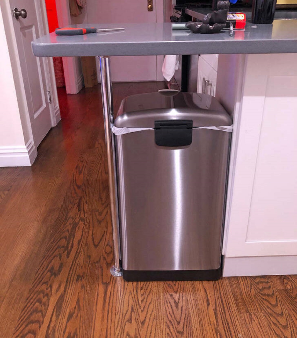 “This trash can I did not measure for fits perfectly in my apartment’s tiny breakfast bar gap.”