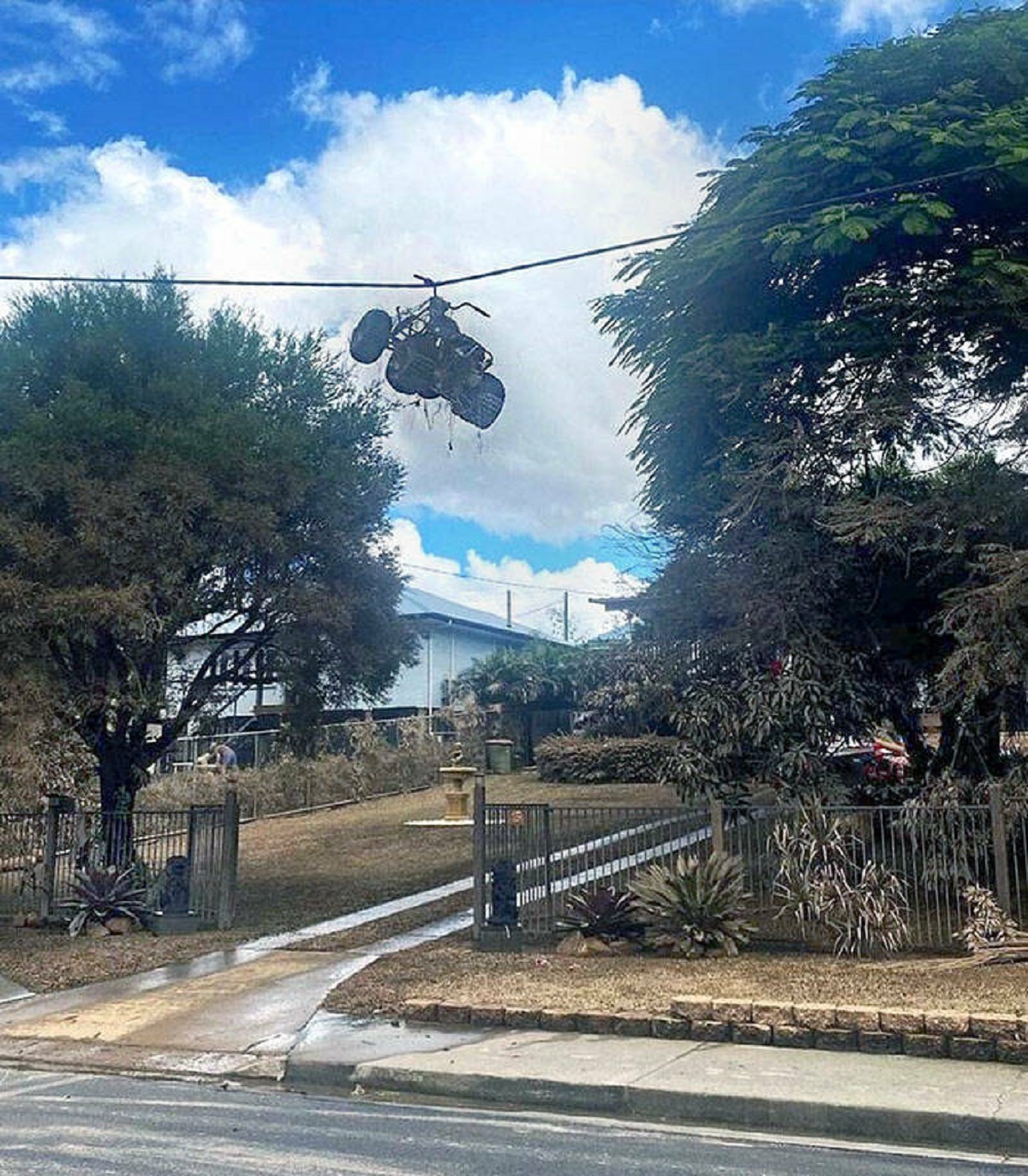 "Quad Bike Hanging From The Power Lines After Record-Breaking Floods In Eastern Australia"