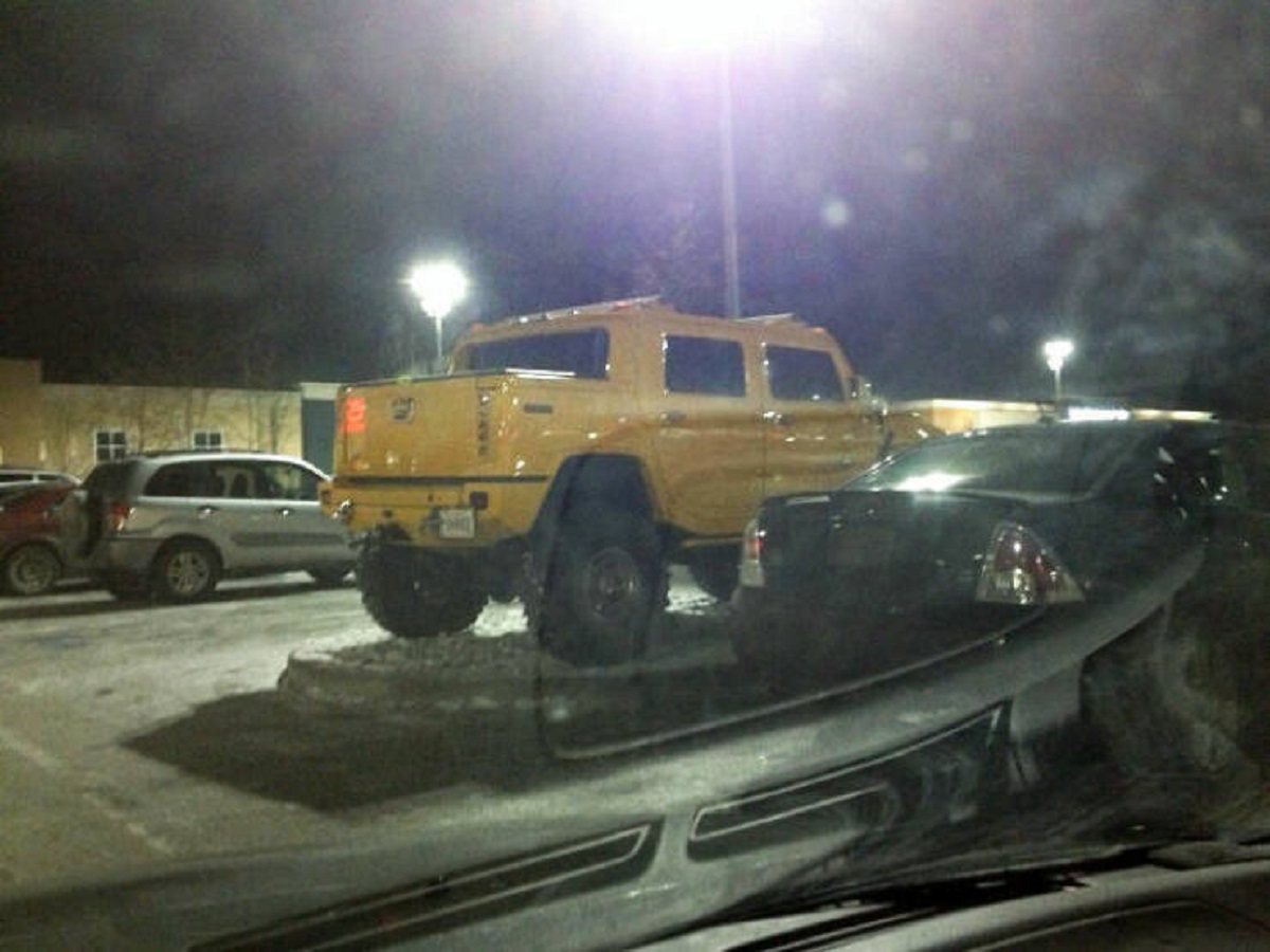 "Black Friday Parking. This Guy Parks On The Plant Bed In Between The Handicap Parking"