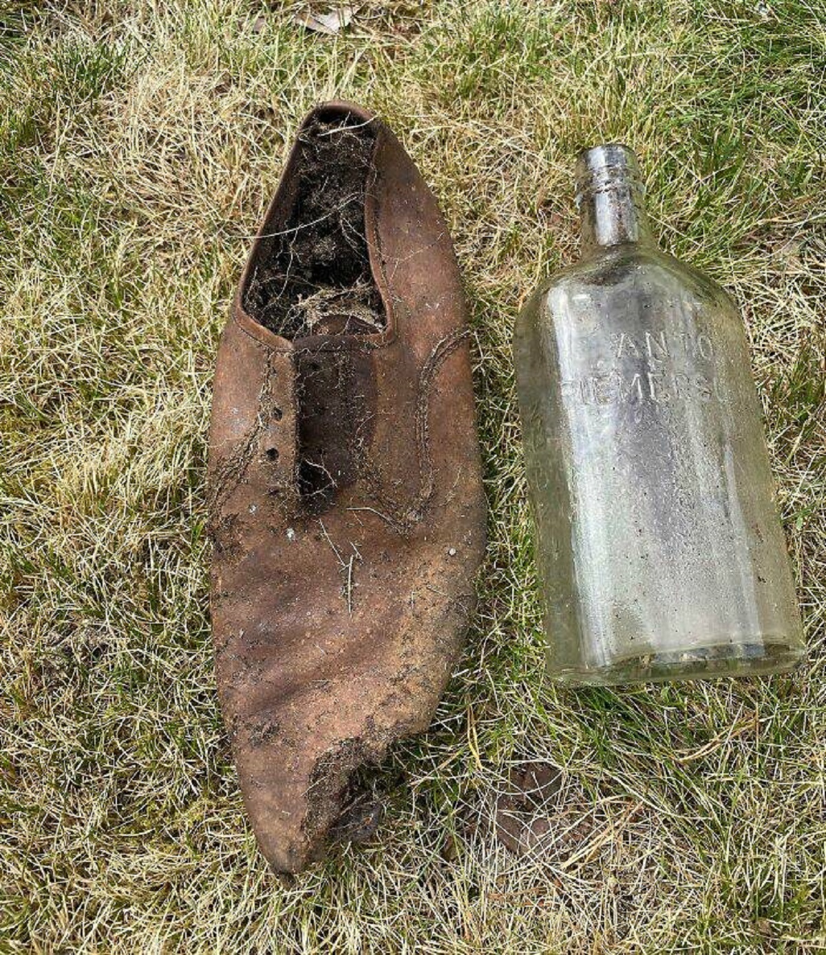 "My Mom Just Found An Old Shoe And A Bottle While Digging In Our Yard"