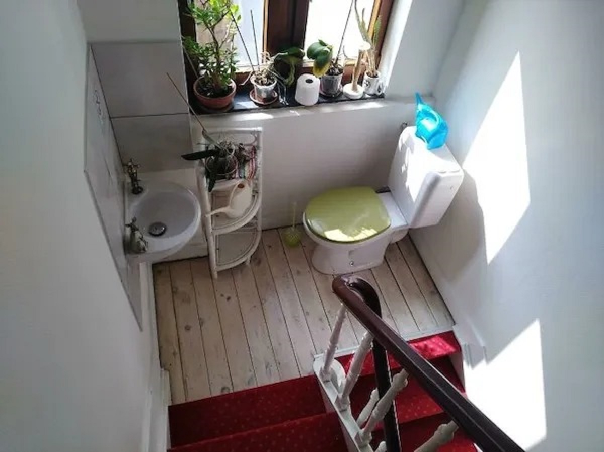 This bathroom in an AirBnB... is in the middle of a staircase.
