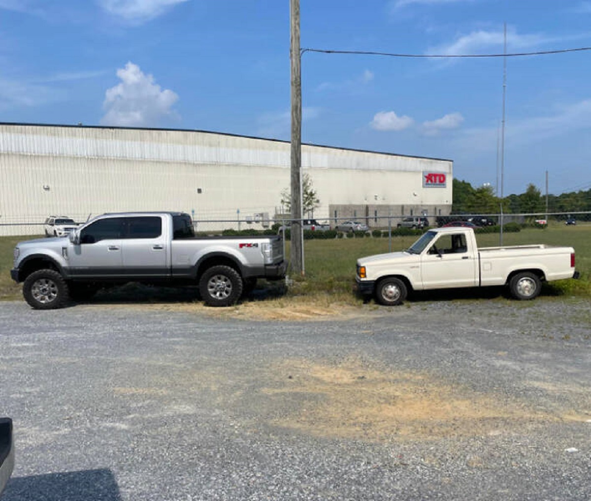 “My car compared to my coworker’s car. My truck is the height of his windows”