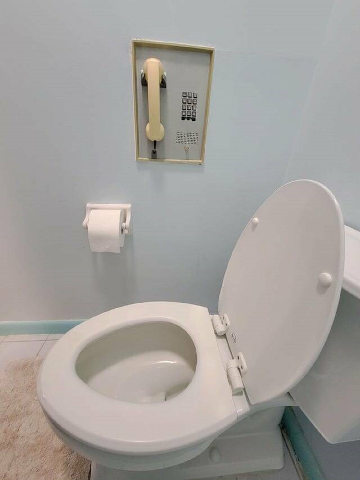 "My grandparent’s bathroom from the 1950s has a built in toilet phone"