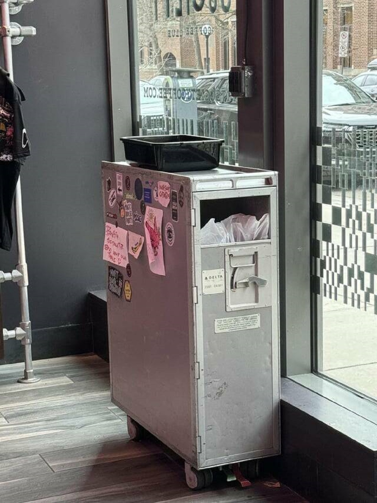 "Coffee shop uses airline food cart as trash cans"