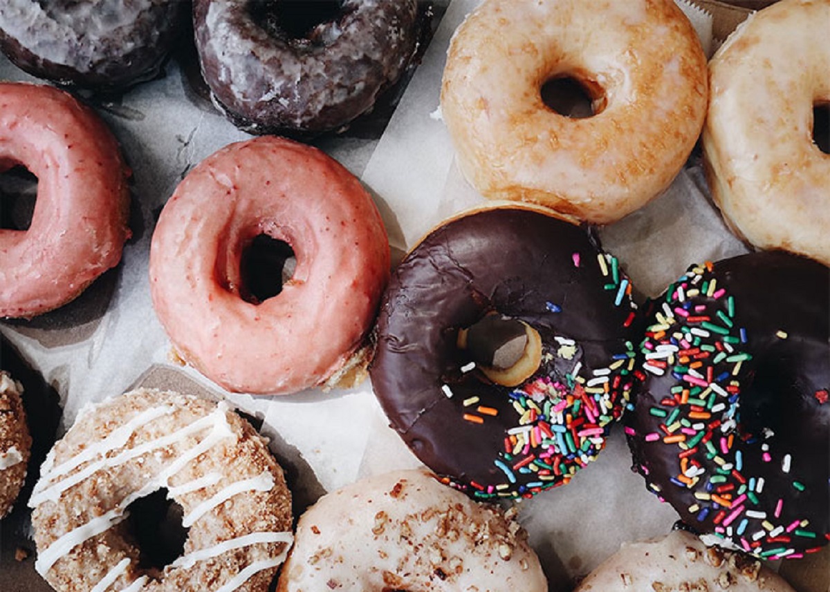 When I worked at a mass production bakery the chocolate for the chocolate covered doughnuts came in giant frozen blocks of 4x4 peices and contained no actual chocolate what so over. When unfrozen it was like some sort of nasty smelling paraffin wax that I would break up with a hammer and place into a melter that would then pour over the doughnuts.