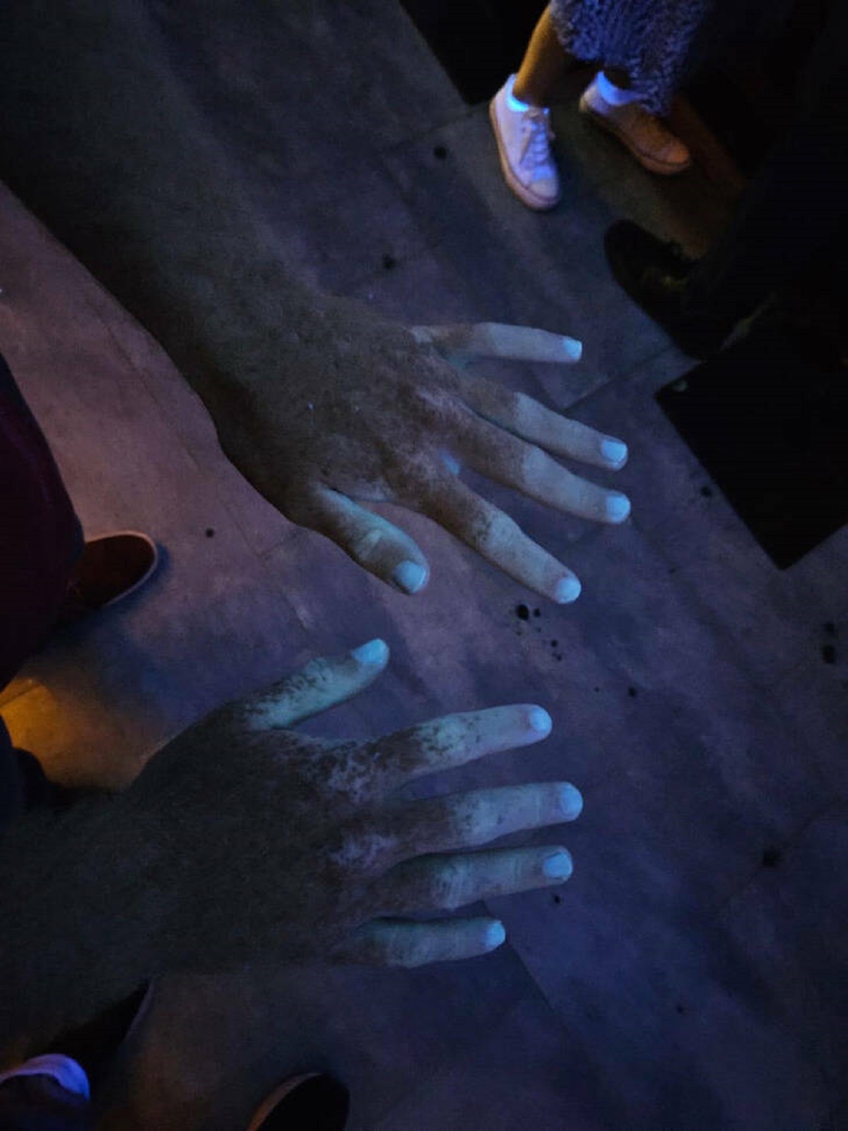 "My hands under a UV light."