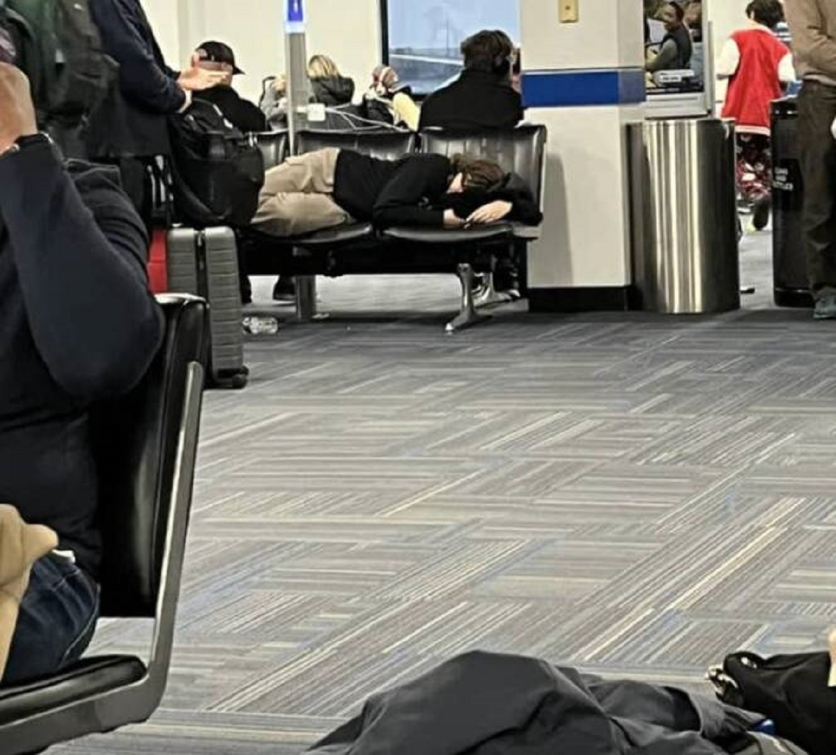 "Girl sleeping across all five seats in the cellphone charging section at the airport when holiday season is in full swing."