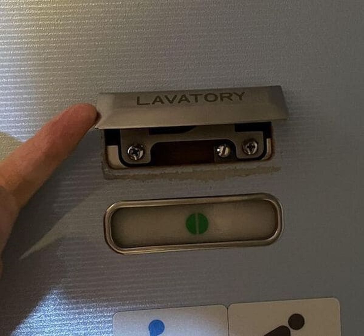 “Locked bathroom doors in airplanes can be unlocked from the outside. The lock bolt is usually hidden under a sign that says ’lavatory’ or something similar.”