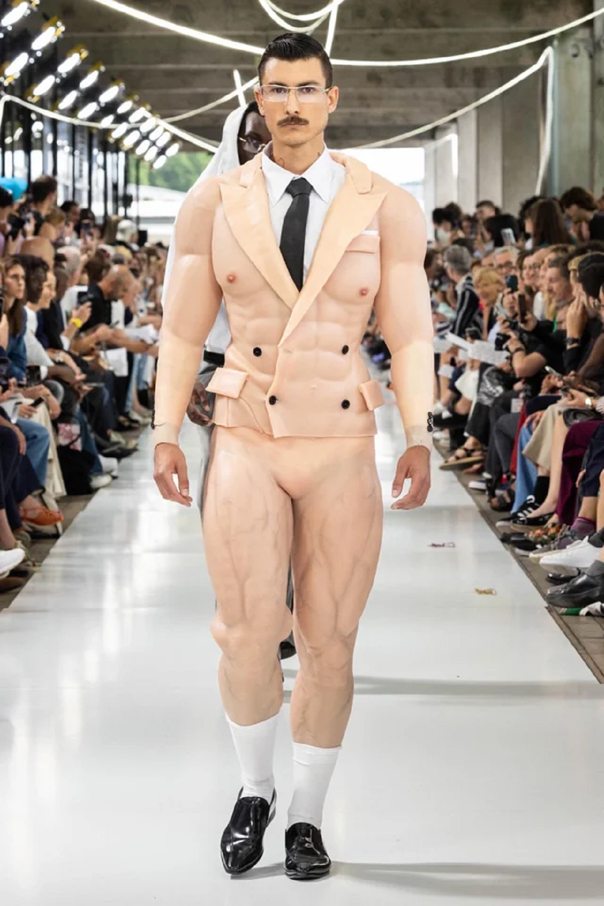 “Full frontal of the skin suit on a fashion runway”