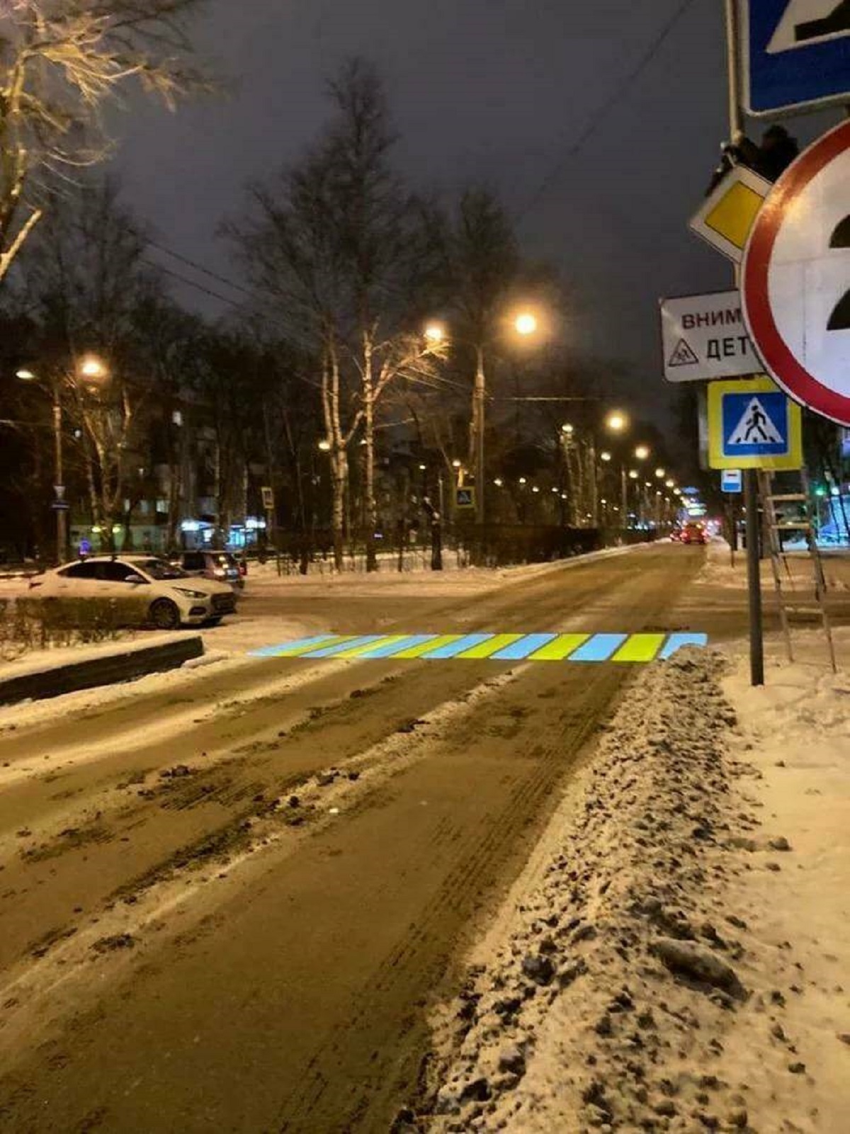 "Crosswalk Projected On A Dirty Winter Road"