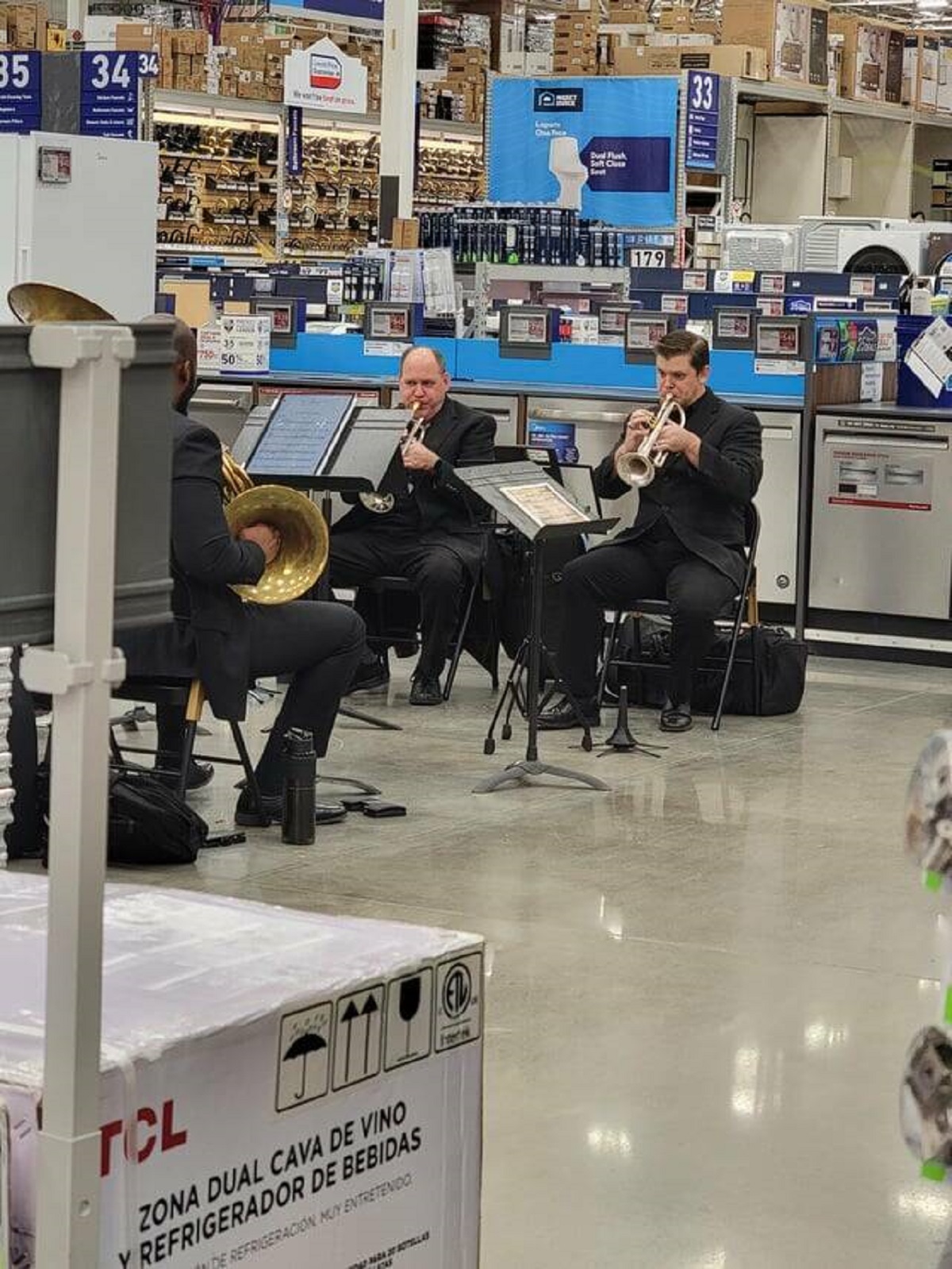 "There is a small orchestra ensemble playing christmas music in the lowes im in"