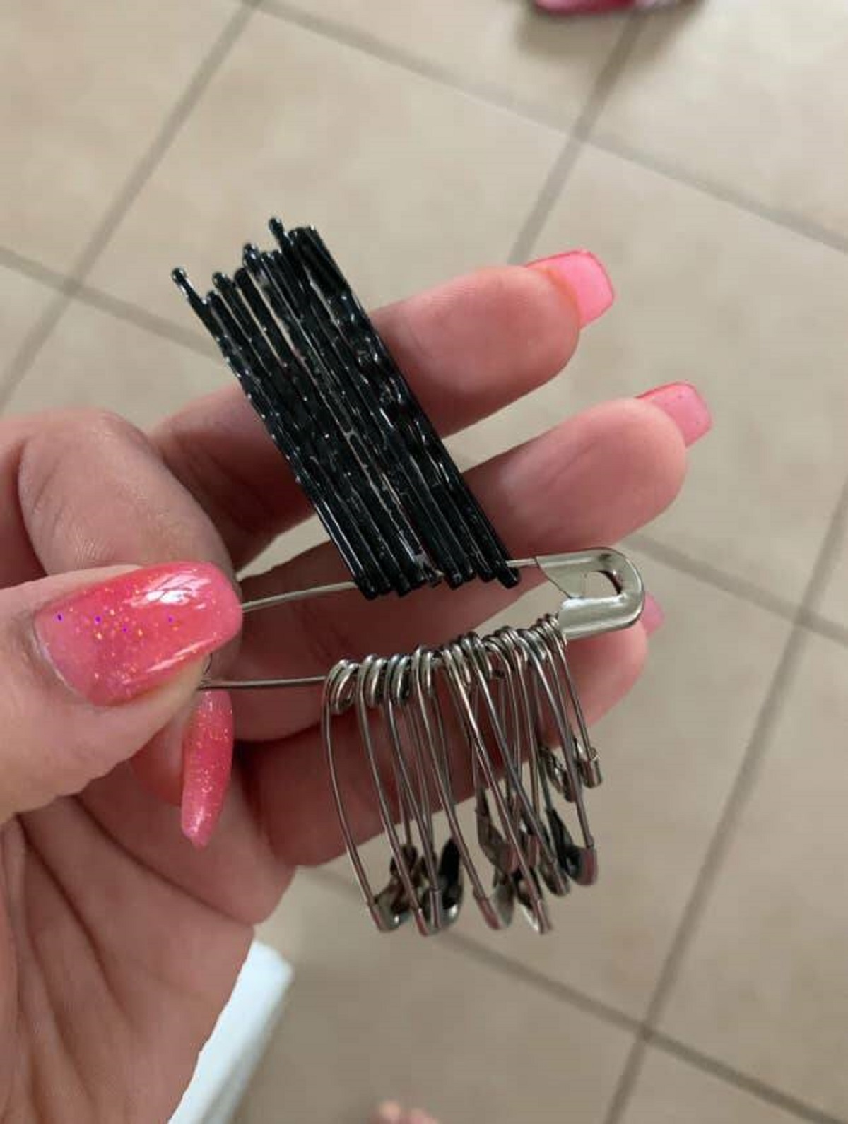 "Use a safety pin to keep all your bobby pins together while traveling."