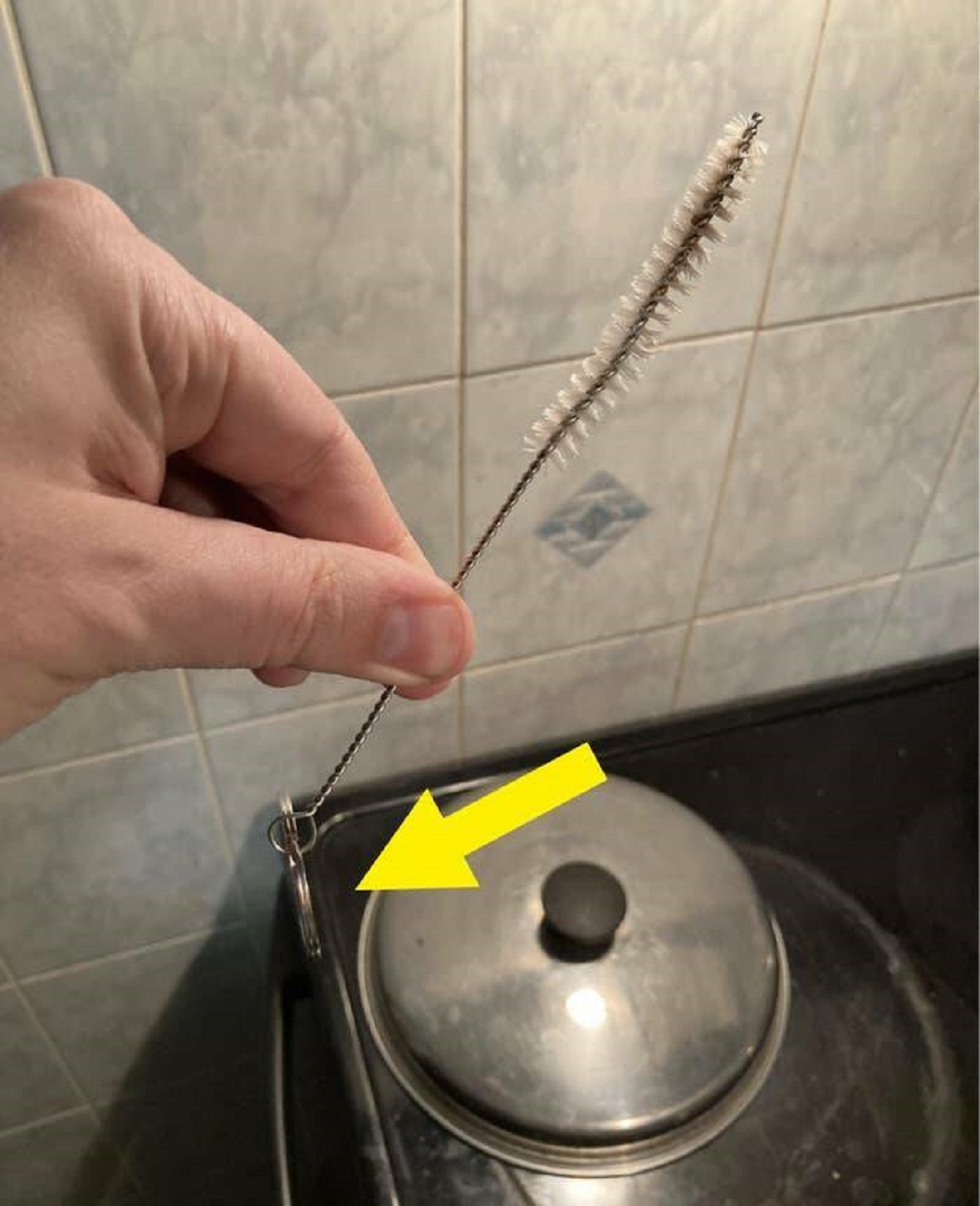 "Have tiny cleaning brushes for straws? Don’t lose them down the drain by putting a key ring on the end."