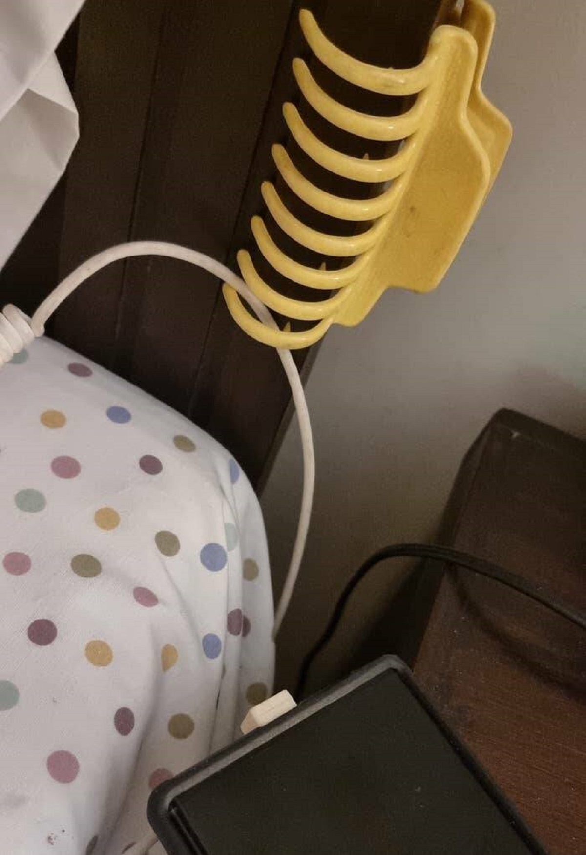 "Use a hair clip to anchor charging cables on your bedside."