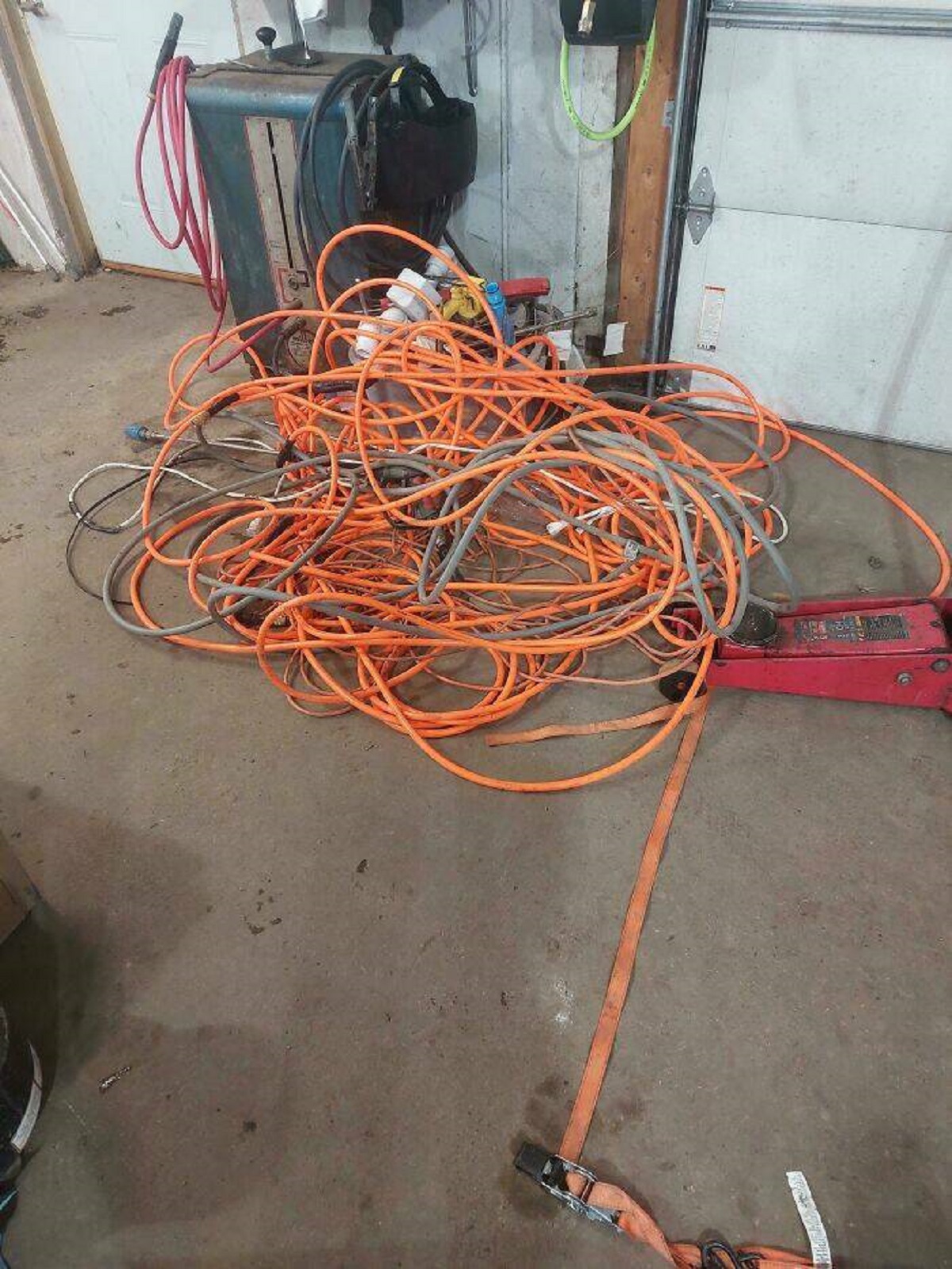 "Coworkers Have Done This Atleast 50 Times Now, It's 100ft Of Power Cord And Air Hose (100' Each), A Long Frozen Pressure Washer Hose And Another Cord"
