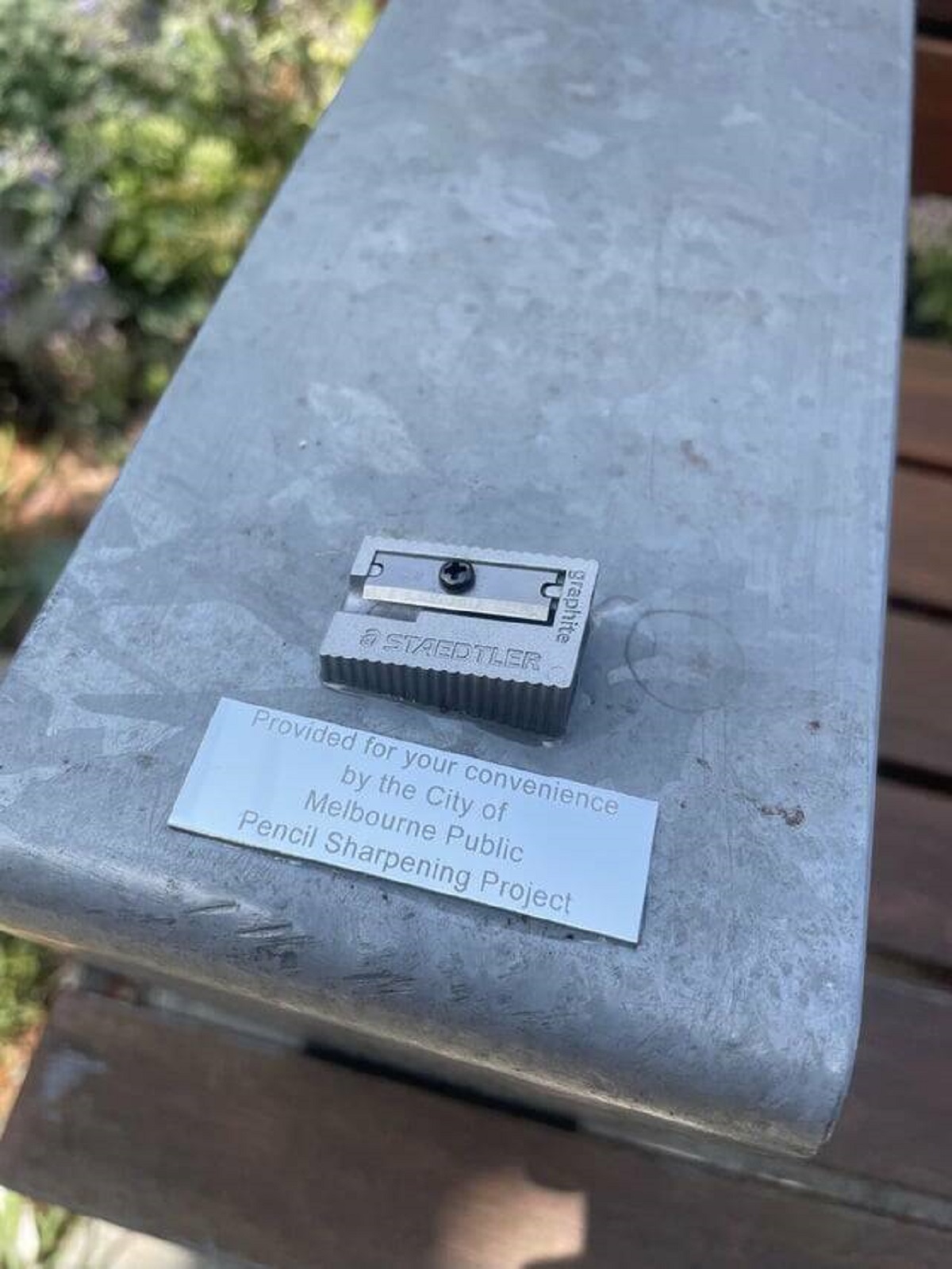"A pencil sharpener on a bench handle in a public park in Melbourne, Australia"