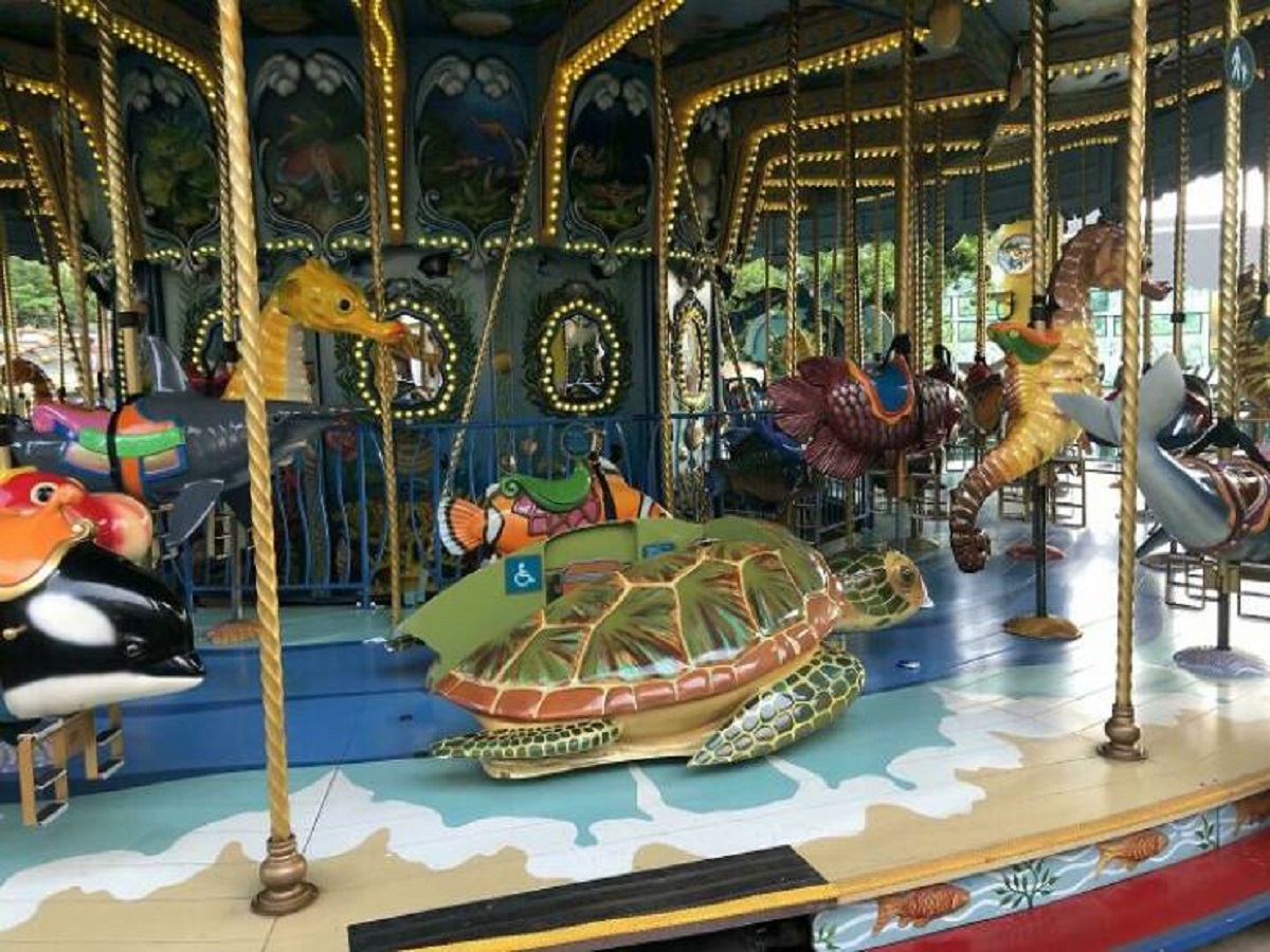 "This Carousel In Hong Kong Has A Sea Turtle Mounted To The Floor For Disabled Children"