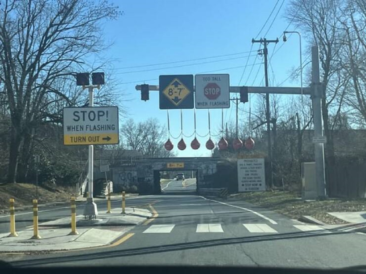 "This “over height vehicle detector” and it’s sign"