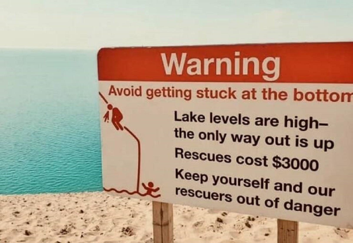 sleeping bear dunes warning sign - Warning Avoid getting stuck at the bottom Lake levels are high the only way out is up Rescues cost $3000 Keep yourself and our rescuers out of danger