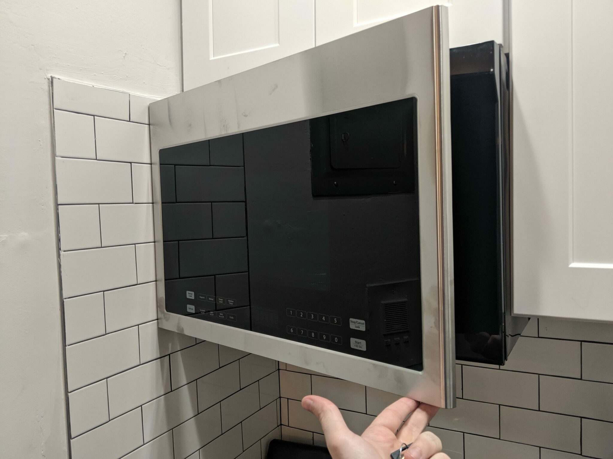 “Landlord hung the microwave, this is as far as it opens before hitting the wall.”