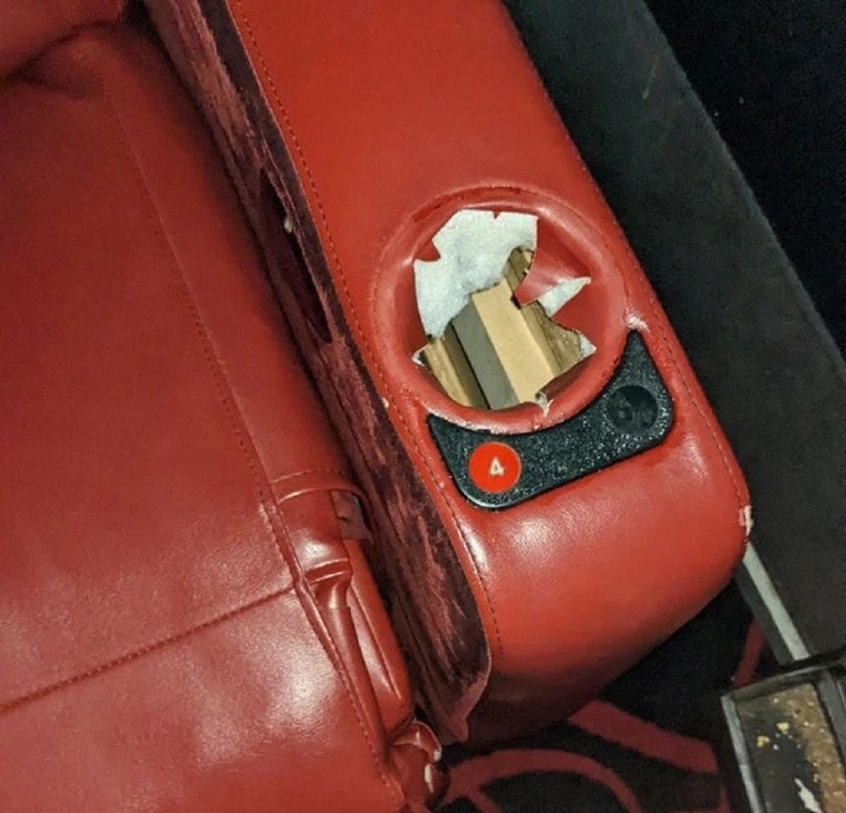 “Who steals a cupholder from a seat?”