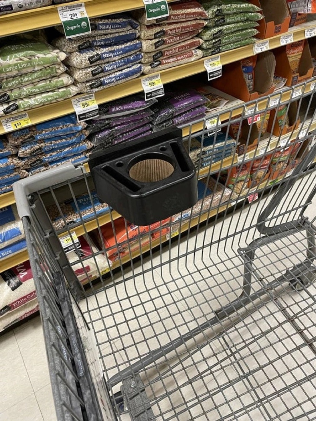 This grocery cart has a drink holder to hold coffee cups while you shop.