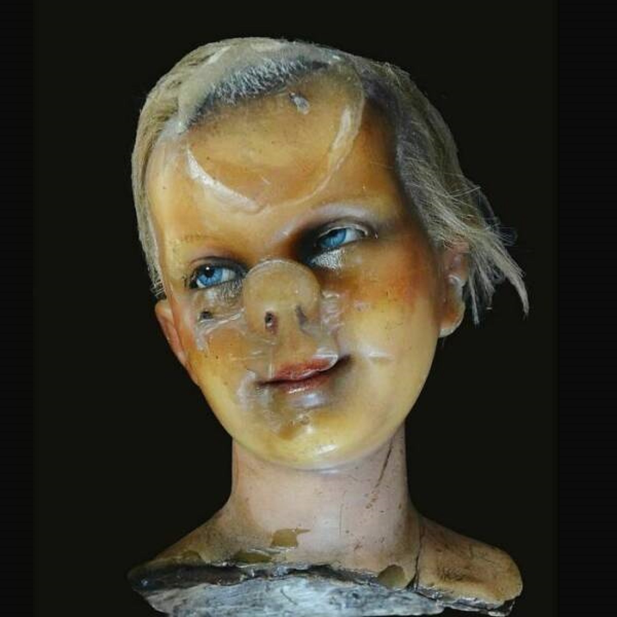 "A Late 19th Century Wax Head From Berlin Which Was Stored Face-Down For Many Years, So That It Deformed Into This Exquisitely Grotesque Nightmare"