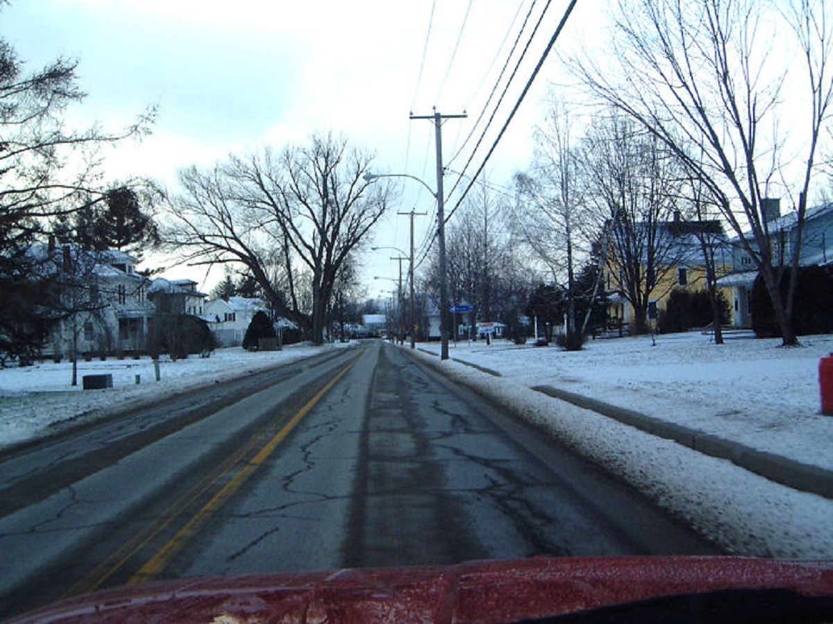 There is a street that is split down the middle by the USA-Canadian border, aptly named Canusa street. People who live in houses on the south side of the street are in the USA, and the north side, in Canada. Crossing the street requires having to report to the border crossing office.