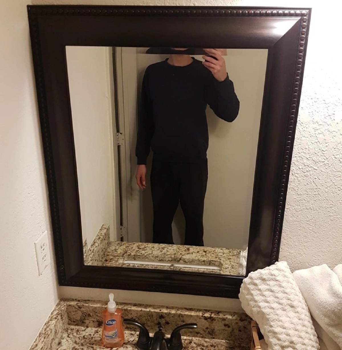 “The mirror at this rental house is placed too low to see myself without hunching.”